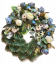 Temetési fenyőkoszorú Exkluzív rózsák, bazsarózsa, kaméliák, gerberák, monstera és kiegészítők 70cm x 80cm