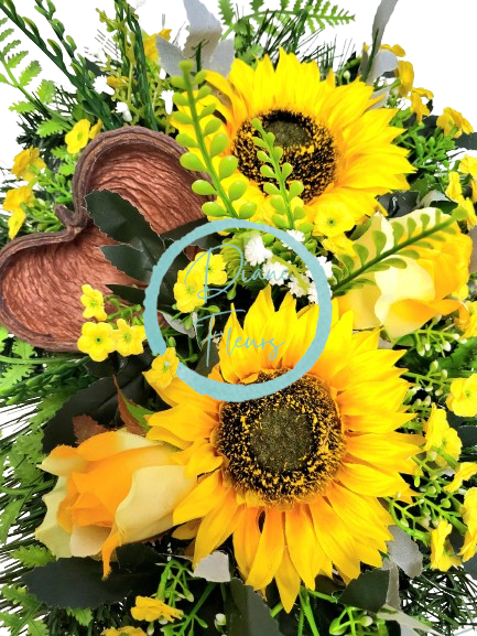 Sympathy arrangement made of artificial Sunflowers, Roses and Accessories 50cm x 28cm x 18cm